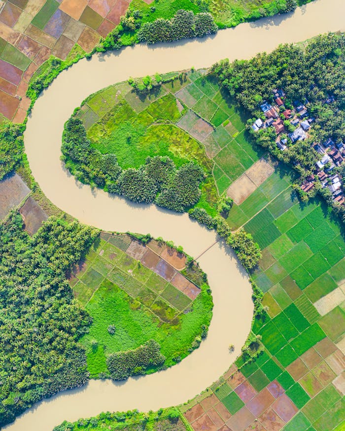 Top View Photo of River Near Farmland